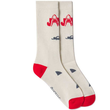 Beige socks with red and blue shark design on a white background JAWS great white shark logo socks by BIOWORLD